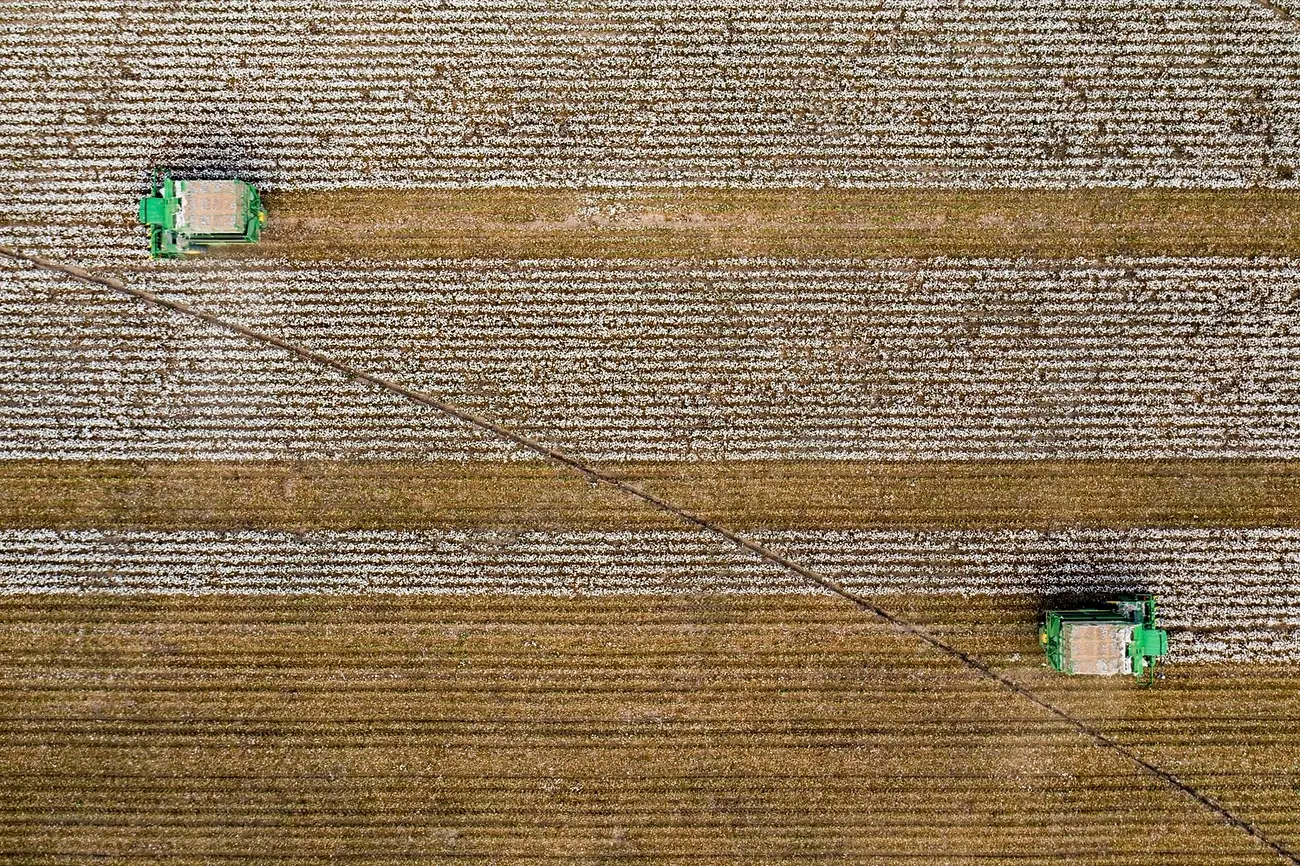 Aerial view of harvesters working a large farm